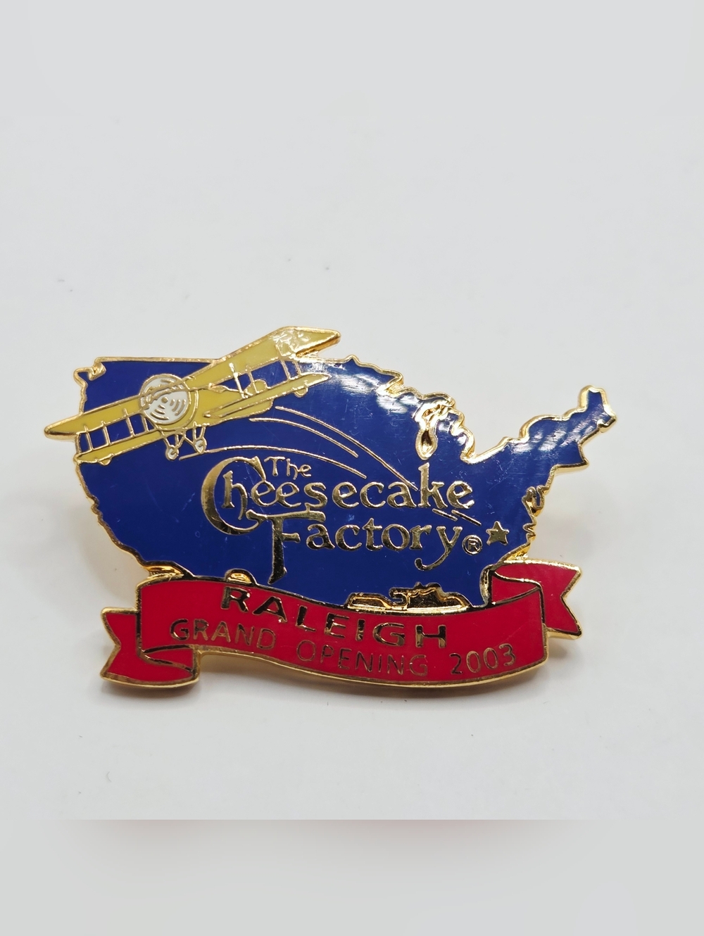 THE CHEESECAKE FACTORY GRAND OPENING PIN RALEIGH NC 2003 MAP AIRPLANE